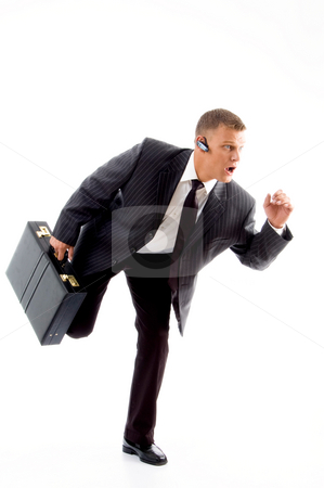 To use this stock image in your creative project, please select the size you need over to the right and click the "Add to Cart" button.
Your downloaded image will come with the Cutcaster watermark removed so don’t worry about the watermark you see on this page. Young accountant holding bag in walking posture stock photo, Young accountant holding bag in walking posture on an isolated white background by Imagery Majestic