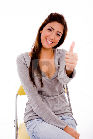 To use this stock image in your creative project, please select the size you need over to the right and click the "Add to Cart" button.
Your downloaded image will come with the Cutcaster watermark removed so don’t worry about the watermark you see on this page. Woman showing thumbs up stock photo, Side view of smiling woman showing thumb up on an isolated background by Imagery Majestic