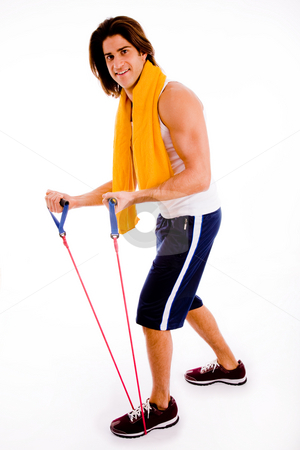 To use this stock image in your creative project, please select the size you need over to the right and click the "Add to Cart" button.
Your downloaded image will come with the Cutcaster watermark removed so don’t worry about the watermark you see on this page. Man working out stock photo, Side view of man stretching rope on an isolated white background by Imagery Majestic