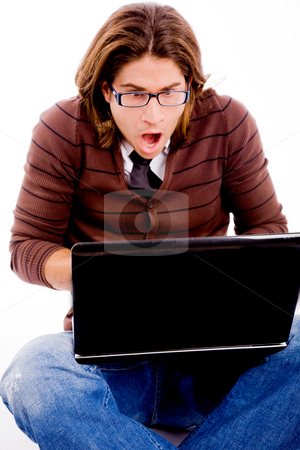 To use this stock image in your creative project, please select the size you need over to the right and click the "Add to Cart" button.
Your downloaded image will come with the Cutcaster watermark removed so don’t worry about the watermark you see on this page. Front view of shocked man looking at laptop stock photo, Front view of shocked man looking at laptop with white background by Imagery Majestic