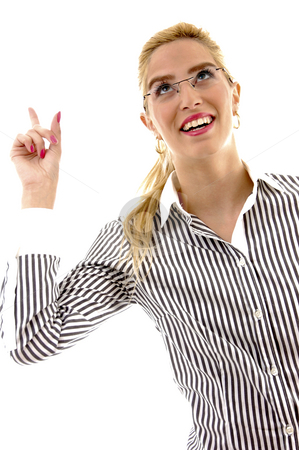 To use this stock image in your creative project, please select the size you need over to the right and click the "Add to Cart" button.
Your downloaded image will come with the Cutcaster watermark removed so don’t worry about the watermark you see on this page. Half length view of businesswoman pointing up stock photo, Half length view of businesswoman pointing up with white background by Imagery Majestic