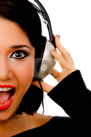 To use this stock image in your creative project, please select the size you need over to the right and click the "Add to Cart" button.
Your downloaded image will come with the Cutcaster watermark removed so don’t worry about the watermark you see on this page. Portrait of happy young female listening music stock photo, Portrait of happy young female listening music on an isolated background by Imagery Majestic