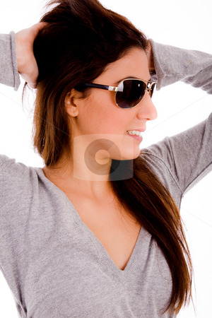 To use this stock image in your creative project, please select the size you need over to the right and click the "Add to Cart" button.
Your downloaded image will come with the Cutcaster watermark removed so don’t worry about the watermark you see on this page. Smiling female with sunglasses holding her hair stock photo, Portrait of smiling female with sunglasses holding her hair on an isolated background by Imagery Majestic