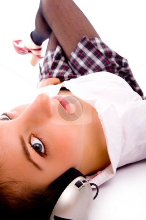 To use this stock image in your creative project, please select the size you need over to the right and click the "Add to Cart" button.
Your downloaded image will come with the Cutcaster watermark removed so don’t worry about the watermark you see on this page. Side pose of woman on floor listening to music stock photo, Side pose of woman on floor listening to music against white background by Imagery Majestic
