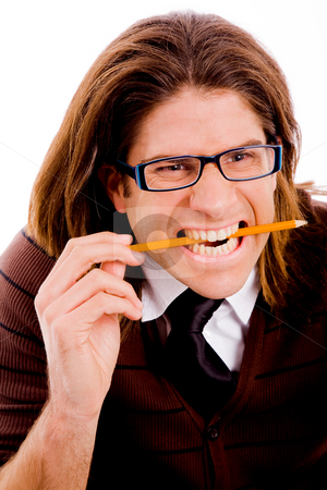 To use this stock image in your creative project, please select the size you need over to the right and click the "Add to Cart" button.
Your downloaded image will come with the Cutcaster watermark removed so don’t worry about the watermark you see on this page. Young male holding pencil with teeth stock photo, Portrait of young male holding pencil with teeth on an isolated white background by Imagery Majestic