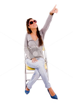 To use this stock image in your creative project, please select the size you need over to the right and click the "Add to Cart" button.
Your downloaded image will come with the Cutcaster watermark removed so don’t worry about the watermark you see on this page. Front view of young female pointing up stock photo, Front view of young female pointing up against white background by Imagery Majestic