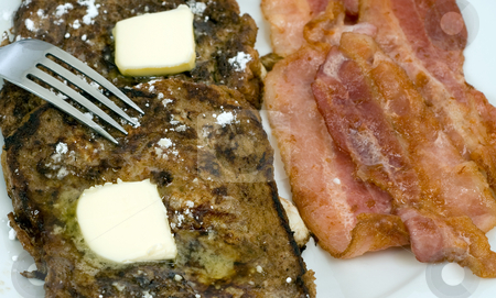To use this stock image in your creative project, please select the size you need over to the right and click the "Add to Cart" button.
Your downloaded image will come with the Cutcaster watermark removed so don’t worry about the watermark you see on this page. Yummy Breakfast stock photo, Closeup view of a yummy breakfast with a fork about to dig in by Richard Nelson