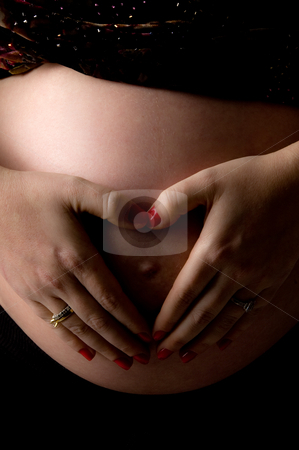To use this stock image in your creative project, please select the size you need over to the right and click the "Add to Cart" button.
Your downloaded image will come with the Cutcaster watermark removed so don’t worry about the watermark you see on this page. Front view of pregnant female's tummy with her hands stock photo, Front view of pregnant female's tummy with her hands on an isolated background by Imagery Majestic