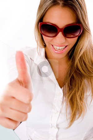 To use this stock image in your creative project, please select the size you need over to the right and click the "Add to Cart" button.
Your downloaded image will come with the Cutcaster watermark removed so don’t worry about the watermark you see on this page. Front view of smiling female with thumbs up stock photo, Front view of smiling female with thumbs up with white background by Imagery Majestic