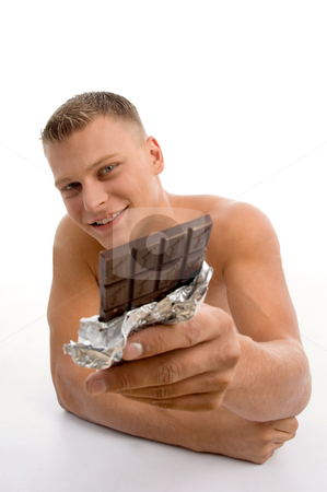 To use this stock image in your creative project, please select the size you need over to the right and click the "Add to Cart" button.
Your downloaded image will come with the Cutcaster watermark removed so don’t worry about the watermark you see on this page. Smiling muscular man showing chocolate stock photo, Smiling muscular man showing chocolate against white background by Imagery Majestic