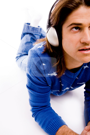 To use this stock image in your creative project, please select the size you need over to the right and click the "Add to Cart" button.
Your downloaded image will come with the Cutcaster watermark removed so don’t worry about the watermark you see on this page. Man listening music stock photo, Halflength view of man listening music on an isolated white background by Imagery Majestic