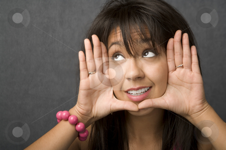 To use this stock image in your creative project, please select the size you need over to the right and click the "Add to Cart" button.
Your downloaded image will come with the Cutcaster watermark removed so don’t worry about the watermark you see on this page. Woman framing her face stock photo, Beautiful young woman framing her face with hands by Scott Griessel
