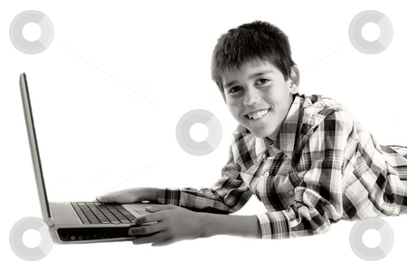 To use this stock image in your creative project, please select the size you need over to the right and click the "Add to Cart" button.
Your downloaded image will come with the Cutcaster watermark removed so don’t worry about the watermark you see on this page. Boy using laptop stock photo, Young boy using laptop by Christopher Meder