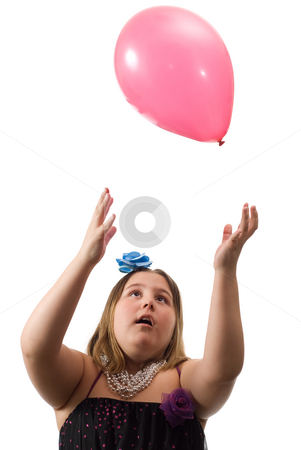 To use this stock image in your creative project, please select the size you need over to the right and click the "Add to Cart" button.
Your downloaded image will come with the Cutcaster watermark removed so don’t worry about the watermark you see on this page. Girl Throwing Balloon stock photo, A young girl tossing a colored ballon up in the air and playing with it, isolated against a white background by Richard Nelson