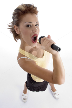 To use this stock image in your creative project, please select the size you need over to the right and click the "Add to Cart" button.
Your downloaded image will come with the Cutcaster watermark removed so don’t worry about the watermark you see on this page. Sexy woman singing in microphone stock photo, Sexy woman singing in microphone on an isolated background by Imagery Majestic