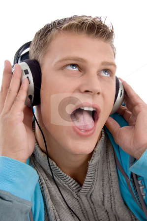 To use this stock image in your creative project, please select the size you need over to the right and click the "Add to Cart" button.
Your downloaded image will come with the Cutcaster watermark removed so don’t worry about the watermark you see on this page. Man listening through headphone stock photo, Man listening through headphone against white background by Imagery Majestic