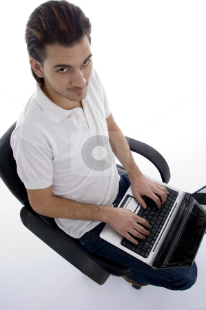 To use this stock image in your creative project, please select the size you need over to the right and click the "Add to Cart" button.
Your downloaded image will come with the Cutcaster watermark removed so don’t worry about the watermark you see on this page. Young man working on laptop stock photo, Young man working on laptop on an isolated white backgound by Imagery Majestic