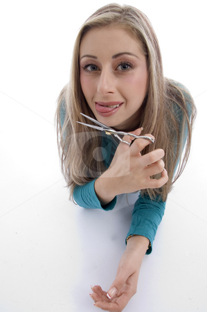 To use this stock image in your creative project, please select the size you need over to the right and click the "Add to Cart" button.
Your downloaded image will come with the Cutcaster watermark removed so don’t worry about the watermark you see on this page. Laying woman holding scissor stock photo, Laying woman holding scissor with white background by Imagery Majestic