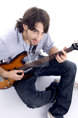 To use this stock image in your creative project, please select the size you need over to the right and click the "Add to Cart" button.
Your downloaded image will come with the Cutcaster watermark removed so don’t worry about the watermark you see on this page. Young guy playing melody stock photo, Young guy playing melody with white background by Imagery Majestic