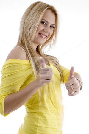 To use this stock image in your creative project, please select the size you need over to the right and click the "Add to Cart" button.
Your downloaded image will come with the Cutcaster watermark removed so don’t worry about the watermark you see on this page. Smiling woman showing good luck sign stock photo, Smiling woman showing good luck sign on an isolated background by Imagery Majestic