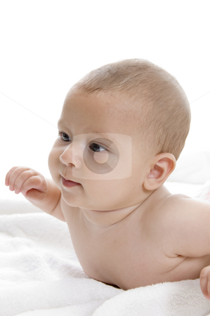 To use this stock image in your creative project, please select the size you need over to the right and click the "Add to Cart" button.
Your downloaded image will come with the Cutcaster watermark removed so don’t worry about the watermark you see on this page. Smiling baby lying stock photo, Smiling baby lying with white background by Imagery Majestic
