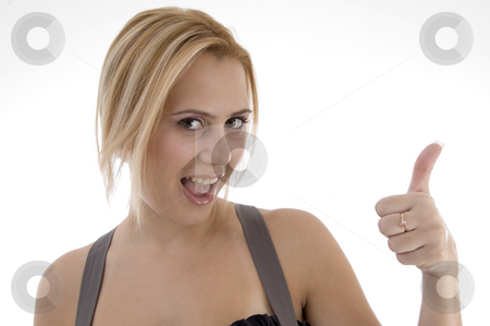 To use this stock image in your creative project, please select the size you need over to the right and click the "Add to Cart" button.
Your downloaded image will come with the Cutcaster watermark removed so don’t worry about the watermark you see on this page. Smiling woman showing thumbs up stock photo, Smiling woman showing thumbs up on an isolated white background by Imagery Majestic