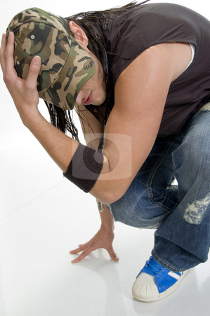 To use this stock image in your creative project, please select the size you need over to the right and click the "Add to Cart" button.
Your downloaded image will come with the Cutcaster watermark removed so don’t worry about the watermark you see on this page. Sitting young male holding cap stock photo, Sitting young male holding cap by Imagery Majestic