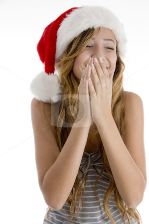 To use this stock image in your creative project, please select the size you need over to the right and click the "Add to Cart" button.
Your downloaded image will come with the Cutcaster watermark removed so don’t worry about the watermark you see on this page. Laughing girl with christmas hat stock photo, Front view of laughing girl with christmas hat on an isolated white background by Imagery Majestic