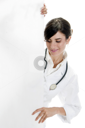 To use this stock image in your creative project, please select the size you need over to the right and click the "Add to Cart" button.
Your downloaded image will come with the Cutcaster watermark removed so don’t worry about the watermark you see on this page. Doctor posing with placard stock photo, Doctor posing with placard on an isolated background by Imagery Majestic