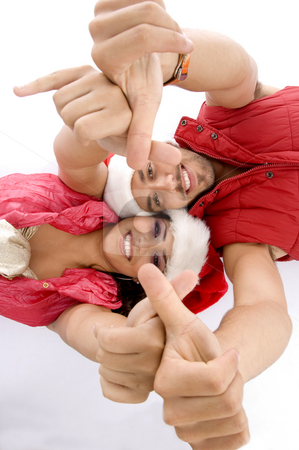 To use this stock image in your creative project, please select the size you need over to the right and click the "Add to Cart" button.
Your downloaded image will come with the Cutcaster watermark removed so don’t worry about the watermark you see on this page. Laying lovers showing hand gesture stock photo, Laying lovers showing hand gesture with white background by Imagery Majestic