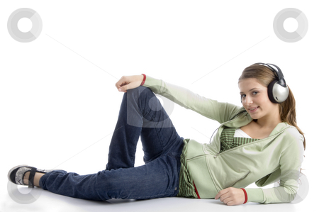 To use this stock image in your creative project, please select the size you need over to the right and click the "Add to Cart" button.
Your downloaded image will come with the Cutcaster watermark removed so don’t worry about the watermark you see on this page. Pretty young woman listening to music stock photo, Pretty young woman listening to music against white background by Imagery Majestic