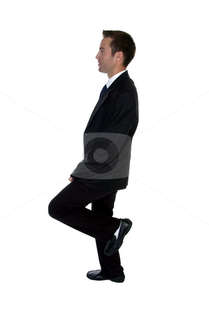 To use this stock image in your creative project, please select the size you need over to the right and click the "Add to Cart" button.
Your downloaded image will come with the Cutcaster watermark removed so don’t worry about the watermark you see on this page. Young businessman benting one leg stock photo, Young businessman benting one leg against white background by Imagery Majestic