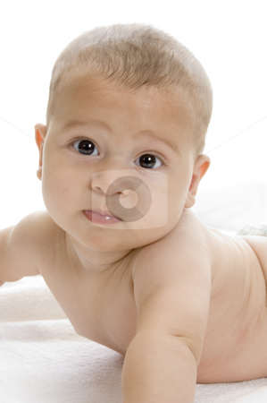 To use this stock image in your creative project, please select the size you need over to the right and click the "Add to Cart" button.
Your downloaded image will come with the Cutcaster watermark removed so don’t worry about the watermark you see on this page. Happy child lying and looking at camera stock photo, Happy child lying and looking at camera on an isolated white background by Imagery Majestic
