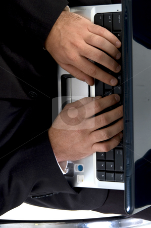 To use this stock image in your creative project, please select the size you need over to the right and click the "Add to Cart" button.
Your downloaded image will come with the Cutcaster watermark removed so don’t worry about the watermark you see on this page. Man hands busy with laptop stock photo, Man hands busy with laptop against white background by Imagery Majestic