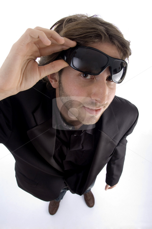 To use this stock image in your creative project, please select the size you need over to the right and click the "Add to Cart" button.
Your downloaded image will come with the Cutcaster watermark removed so don’t worry about the watermark you see on this page. Standing man holding sunglasses stock photo, Standing man holding sunglasses on an isolated background by Imagery Majestic