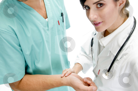 To use this stock image in your creative project, please select the size you need over to the right and click the "Add to Cart" button.
Your downloaded image will come with the Cutcaster watermark removed so don’t worry about the watermark you see on this page. Young nurse checking pulse of patient stock photo, Young nurse checking pulse of patient with white background by Imagery Majestic