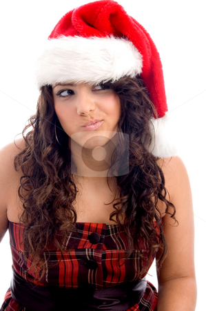 To use this stock image in your creative project, please select the size you need over to the right and click the "Add to Cart" button.
Your downloaded image will come with the Cutcaster watermark removed so don’t worry about the watermark you see on this page. Woman with christmas hat making face stock photo, Woman with christmas hat making face against white background by Imagery Majestic