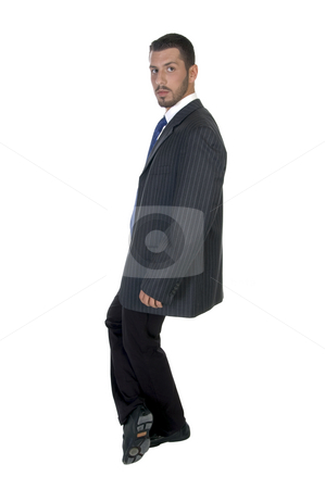 To use this stock image in your creative project, please select the size you need over to the right and click the "Add to Cart" button.
Your downloaded image will come with the Cutcaster watermark removed so don’t worry about the watermark you see on this page. Stylish pose of successful businessman stock photo, Stylish pose of successful businessman on an isolated white background by Imagery Majestic