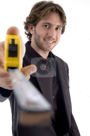 To use this stock image in your creative project, please select the size you need over to the right and click the "Add to Cart" button.
Your downloaded image will come with the Cutcaster watermark removed so don’t worry about the watermark you see on this page. Male showing measuring tape stock photo, Male showing measuring tape on an isolated white background by Imagery Majestic
