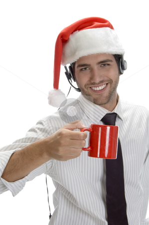 To use this stock image in your creative project, please select the size you need over to the right and click the "Add to Cart" button.
Your downloaded image will come with the Cutcaster watermark removed so don’t worry about the watermark you see on this page. Young man enjoying coffee and wearing santa cap stock photo, Young man enjoying coffee and wearing santa cap isolated on white background by Imagery Majestic