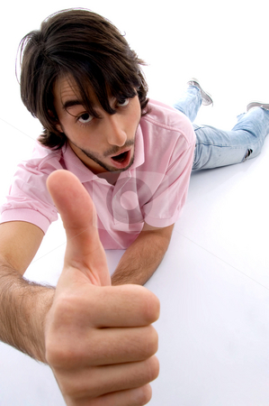 To use this stock image in your creative project, please select the size you need over to the right and click the "Add to Cart" button.
Your downloaded image will come with the Cutcaster watermark removed so don’t worry about the watermark you see on this page. Laying man wishing goodluck stock photo, Laying man wishing goodluck on an isolated white background by Imagery Majestic