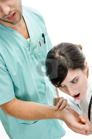 To use this stock image in your creative project, please select the size you need over to the right and click the "Add to Cart" button.
Your downloaded image will come with the Cutcaster watermark removed so don’t worry about the watermark you see on this page. Nurse checking pulse of patient stock photo, Nurse checking pulse of patient on an isolated background by Imagery Majestic