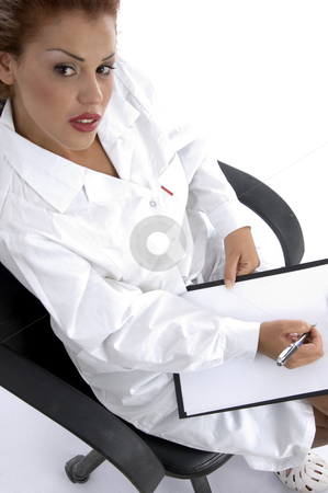 To use this stock image in your creative project, please select the size you need over to the right and click the "Add to Cart" button.
Your downloaded image will come with the Cutcaster watermark removed so don’t worry about the watermark you see on this page. Sitting doctor with writing board stock photo, Doctor sitting with writing board against white background by Imagery Majestic