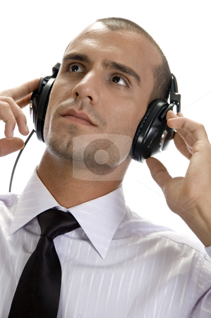 To use this stock image in your creative project, please select the size you need over to the right and click the "Add to Cart" button.
Your downloaded image will come with the Cutcaster watermark removed so don’t worry about the watermark you see on this page. Smart businessman with headphone stock photo, Smart businessman with headphone on an isolated background by Imagery Majestic