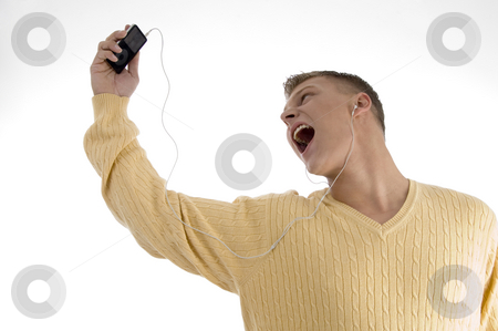 To use this stock image in your creative project, please select the size you need over to the right and click the "Add to Cart" button.
Your downloaded image will come with the Cutcaster watermark removed so don’t worry about the watermark you see on this page. Man enjoying music with ipod stock photo, Man enjoying music with ipod on an isolated background by Imagery Majestic