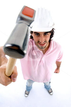 To use this stock image in your creative project, please select the size you need over to the right and click the "Add to Cart" button.
Your downloaded image will come with the Cutcaster watermark removed so don’t worry about the watermark you see on this page. Standing architect showing hammer stock photo, Standing architect showing hammer on an isolated background by Imagery Majestic