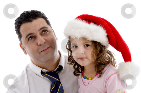 To use this stock image in your creative project, please select the size you need over to the right and click the "Add to Cart" button.
Your downloaded image will come with the Cutcaster watermark removed so don’t worry about the watermark you see on this page. Girl wearing christmas hat posing with her father stock photo, Little girl wearing christmas hat posing with her father by Imagery Majestic