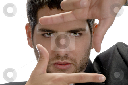 To use this stock image in your creative project, please select the size you need over to the right and click the "Add to Cart" button.
Your downloaded image will come with the Cutcaster watermark removed so don’t worry about the watermark you see on this page. Man showing framing hand gesture stock photo, Man showing framing hand gesture on an isolated background by Imagery Majestic