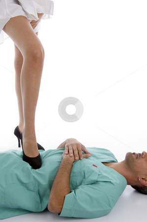 To use this stock image in your creative project, please select the size you need over to the right and click the "Add to Cart" button.
Your downloaded image will come with the Cutcaster watermark removed so don’t worry about the watermark you see on this page. Patient keeping leg on doctor's chest stock photo, Patient keeping leg on doctor's chest on an isolated white background by Imagery Majestic