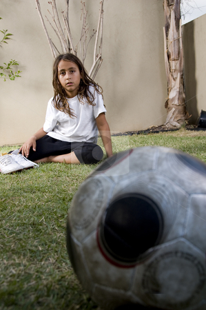 To use this stock image in your creative project, please select the size you need over to the right and click the "Add to Cart" button.
Your downloaded image will come with the Cutcaster watermark removed so don’t worry about the watermark you see on this page. Tired boy sitting near soccer ball stock photo, Tired boy sitting on lawn near soccer ball by Imagery Majestic